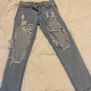 Reverse ripped blue jeans